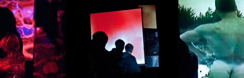 Multi-panel video installation with abstract red/purple projections, silhouetted figures watching a red screen, and a green-toned video of a nude figure in nature.