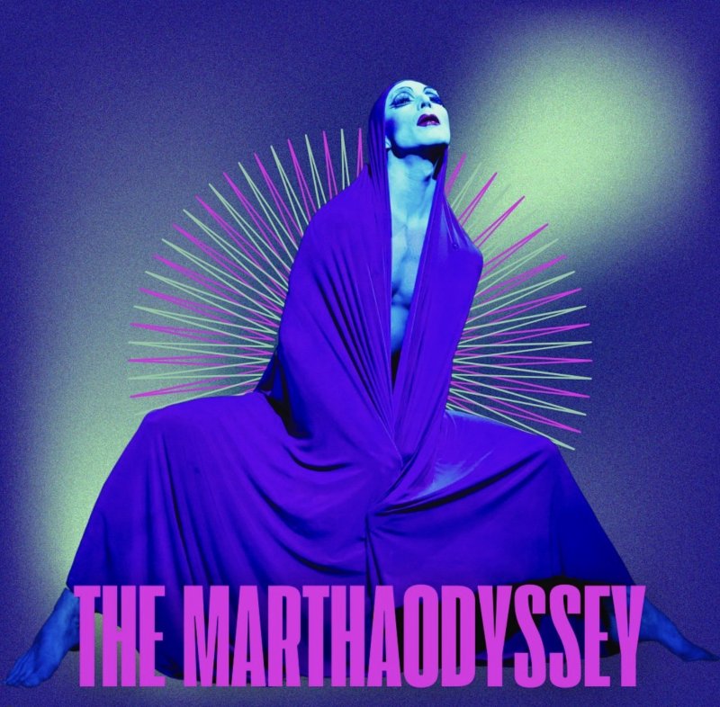 Figure in blue light draped in purple fabric, posed with head tilted back. Behind, radiating lines of pink and pale green. "THE MARTHAODYSSEY" in pink text at the bottom.